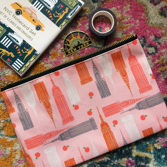 Handy zip pouch in pastel pink featuring a unique design inspired by the skyscrapers of NYC