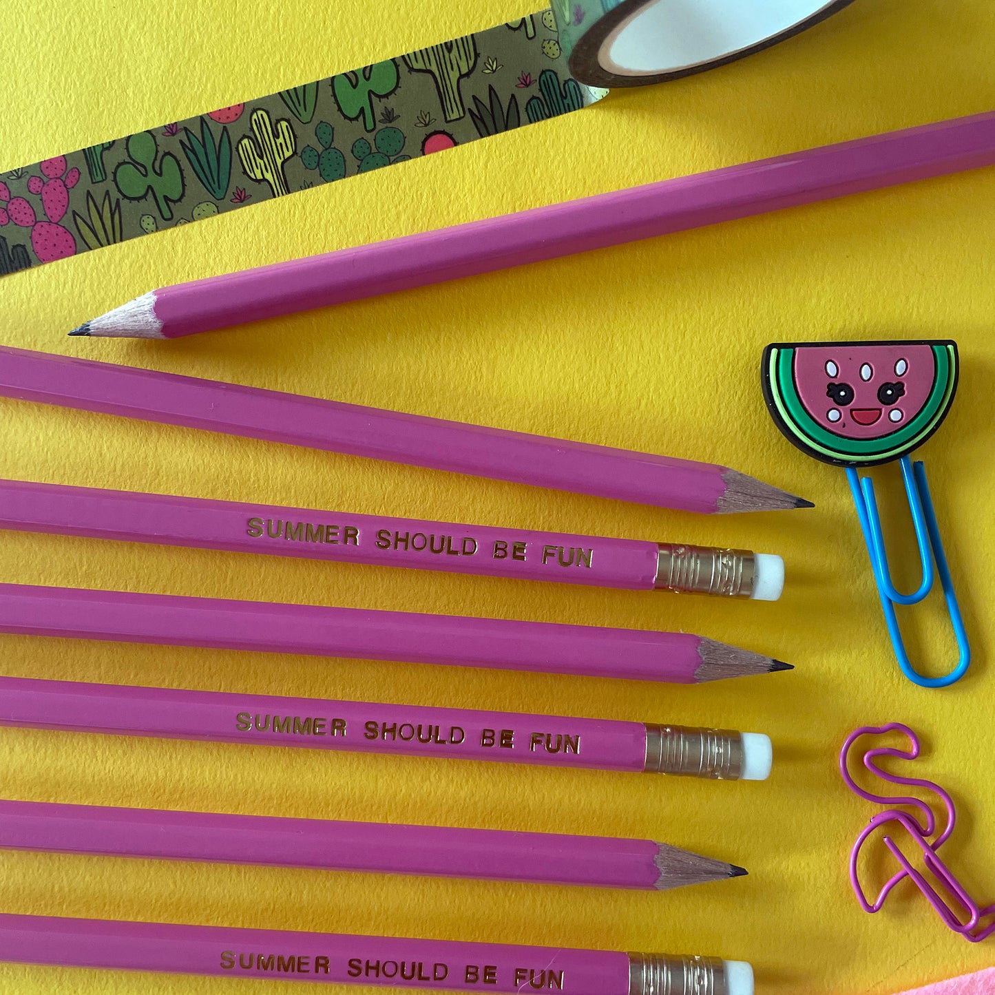 Image of a pink pencil with the words summer should be fun' embossed in gold lettering