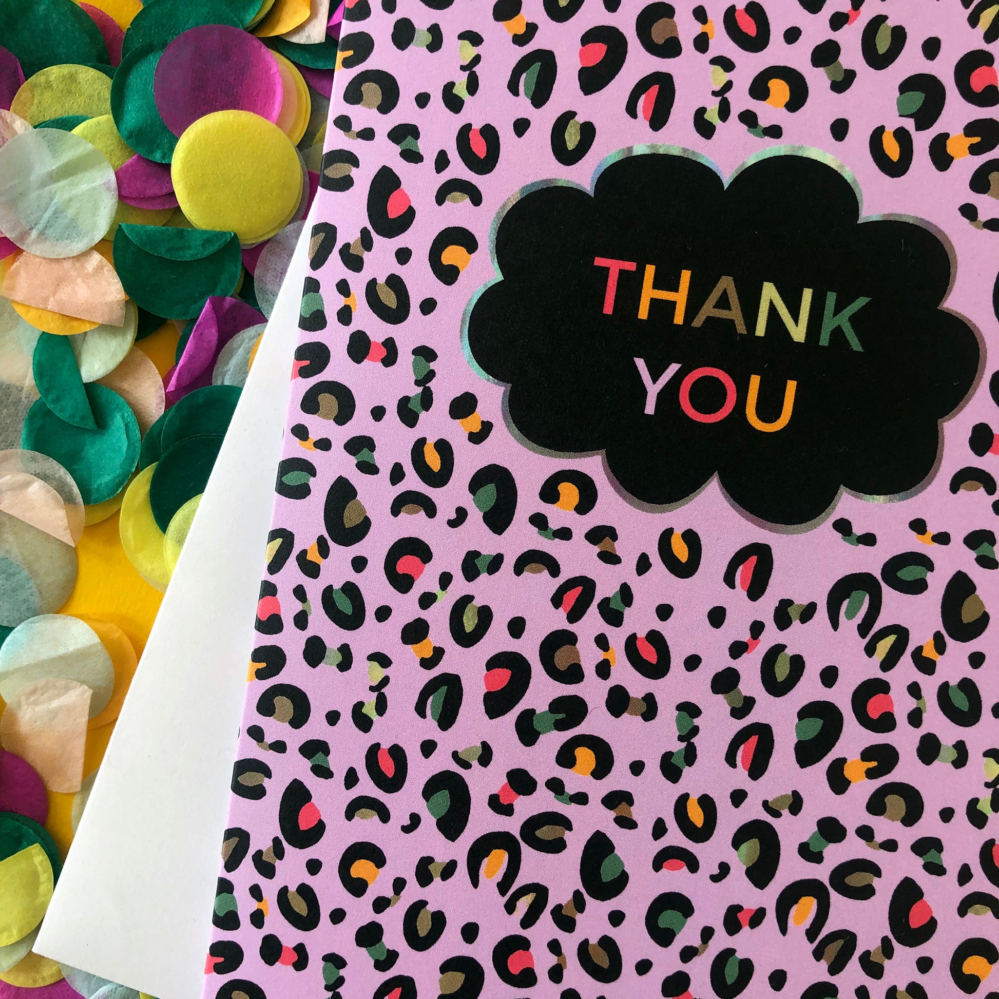 Image of a leopard Print Thank you card with lilac print and pops of neon.