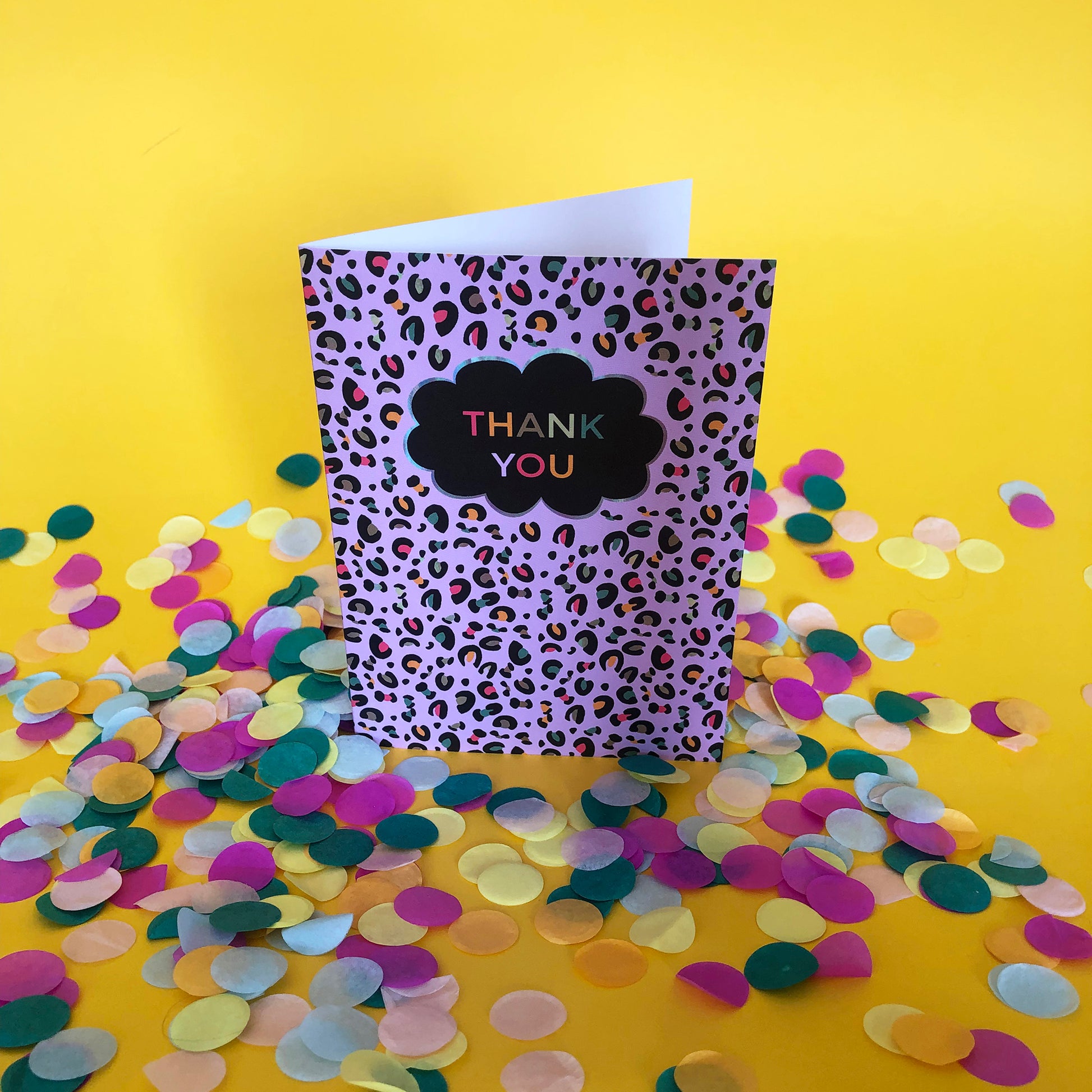 Image of a leopard Print Thank you card with lilac print and pops of neon.