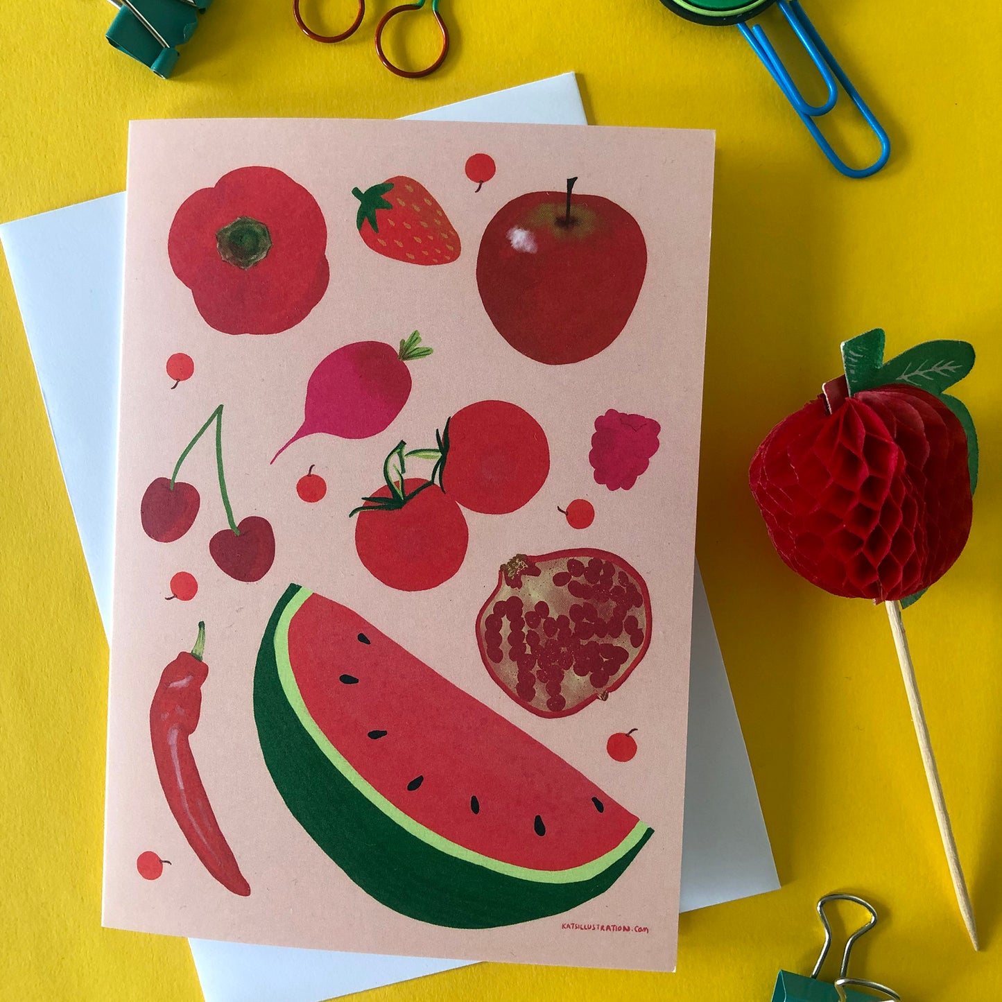 Image shows a red illustrated notecard featuring fresh fruits and veggies..