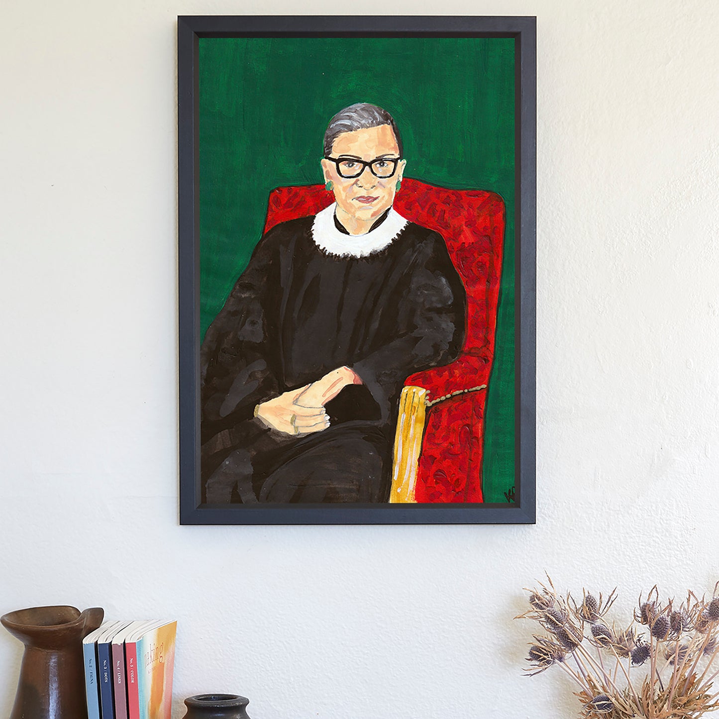 Image of a framed art print of a portrait of Ruth Bader Ginsburg sitting on a red chair with a green background, originally painted in acrylics