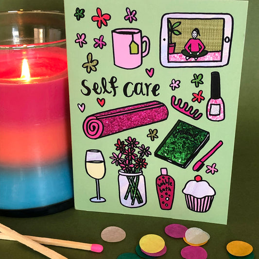 Image show a green greetings card that says 'self care' and features a fun pattern of self care items