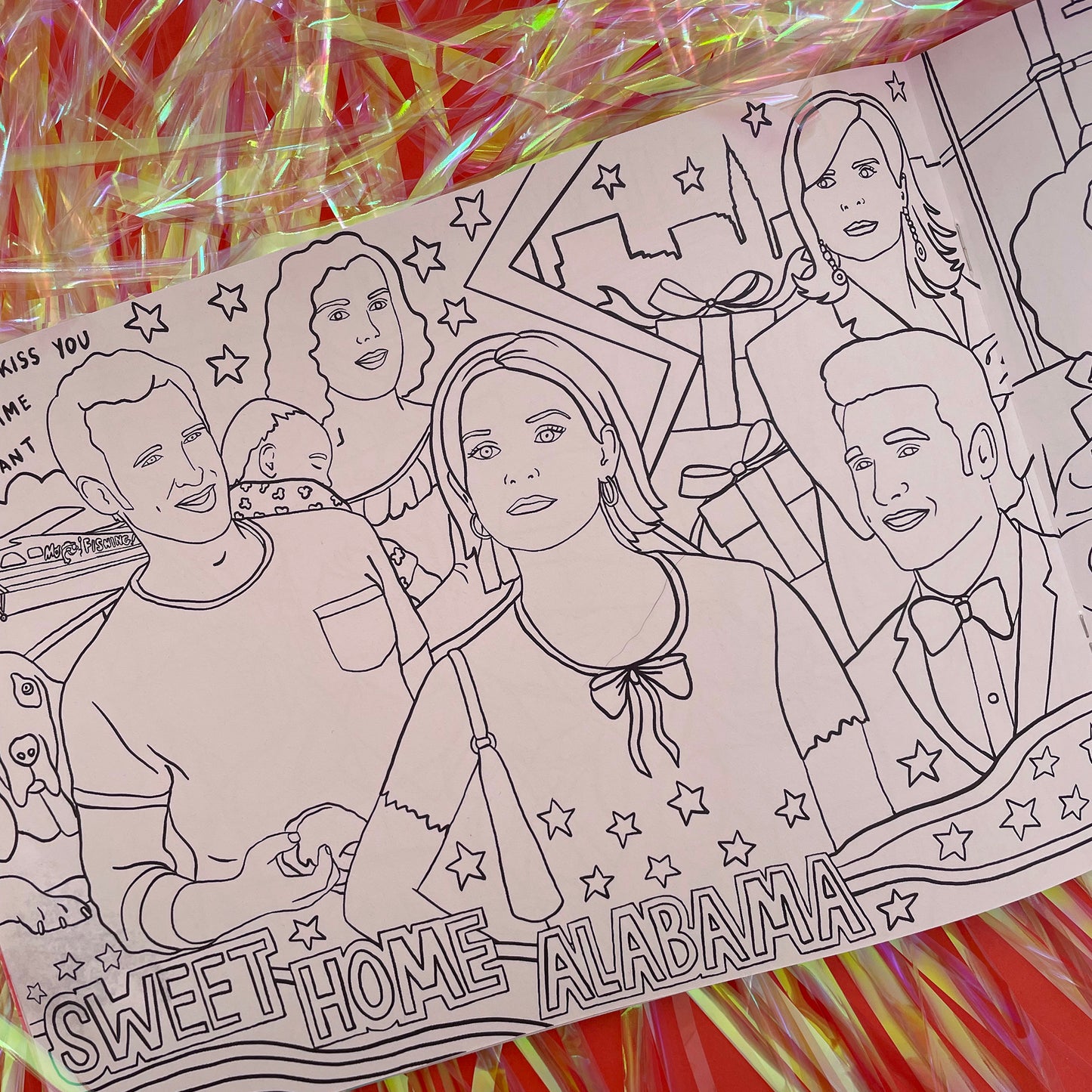 Image shows a page from a colouring book featuring illustrations inspired by 00s rom com Sweet Home Alabama.