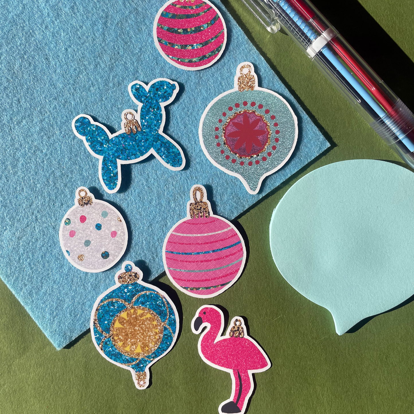 Image features a set of colourful Christmas stickers inspired by baubles.