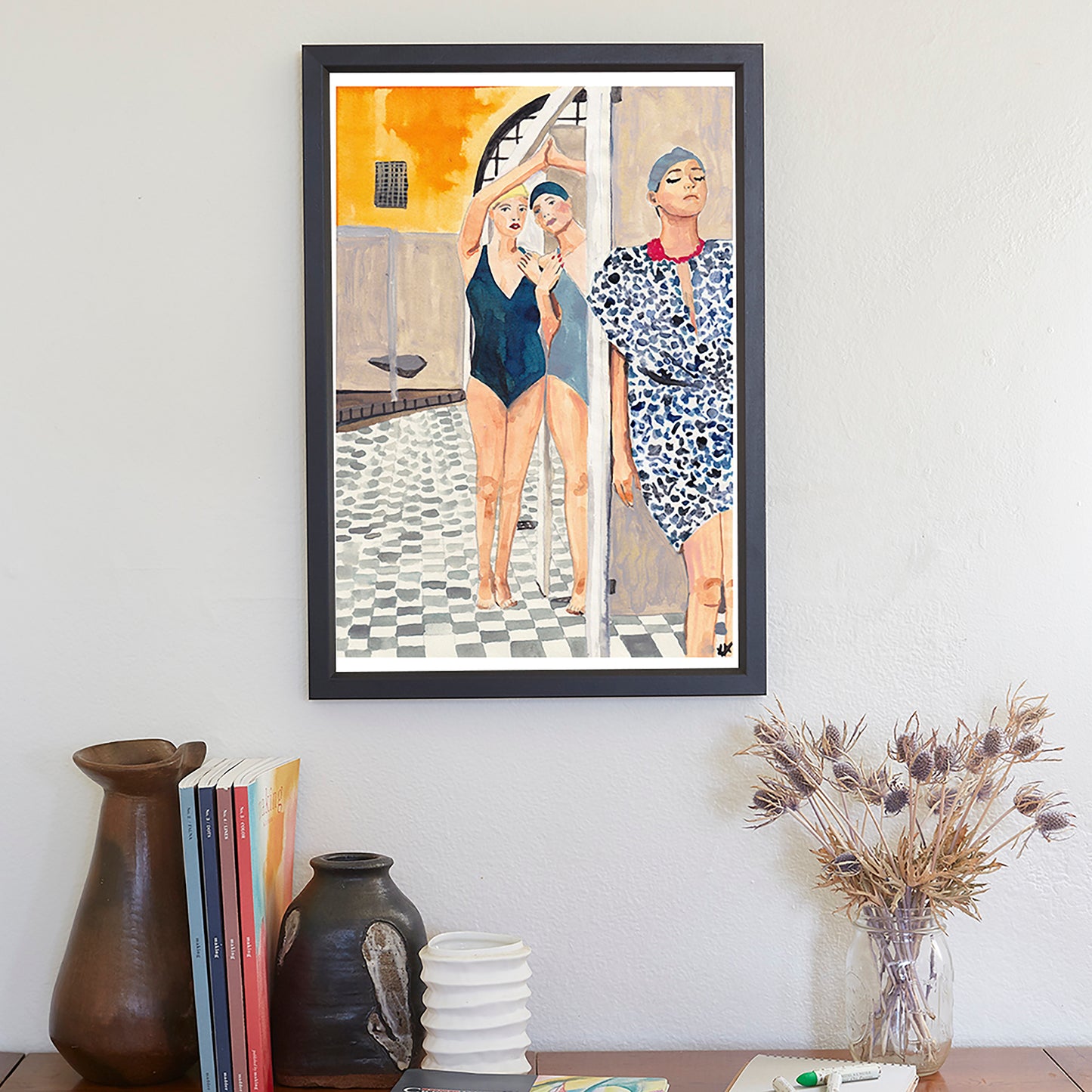 Image shows a framed ink illustration inspired by a vintage bath house image of ladies in swimwear, drawn in blue and yellow inks
