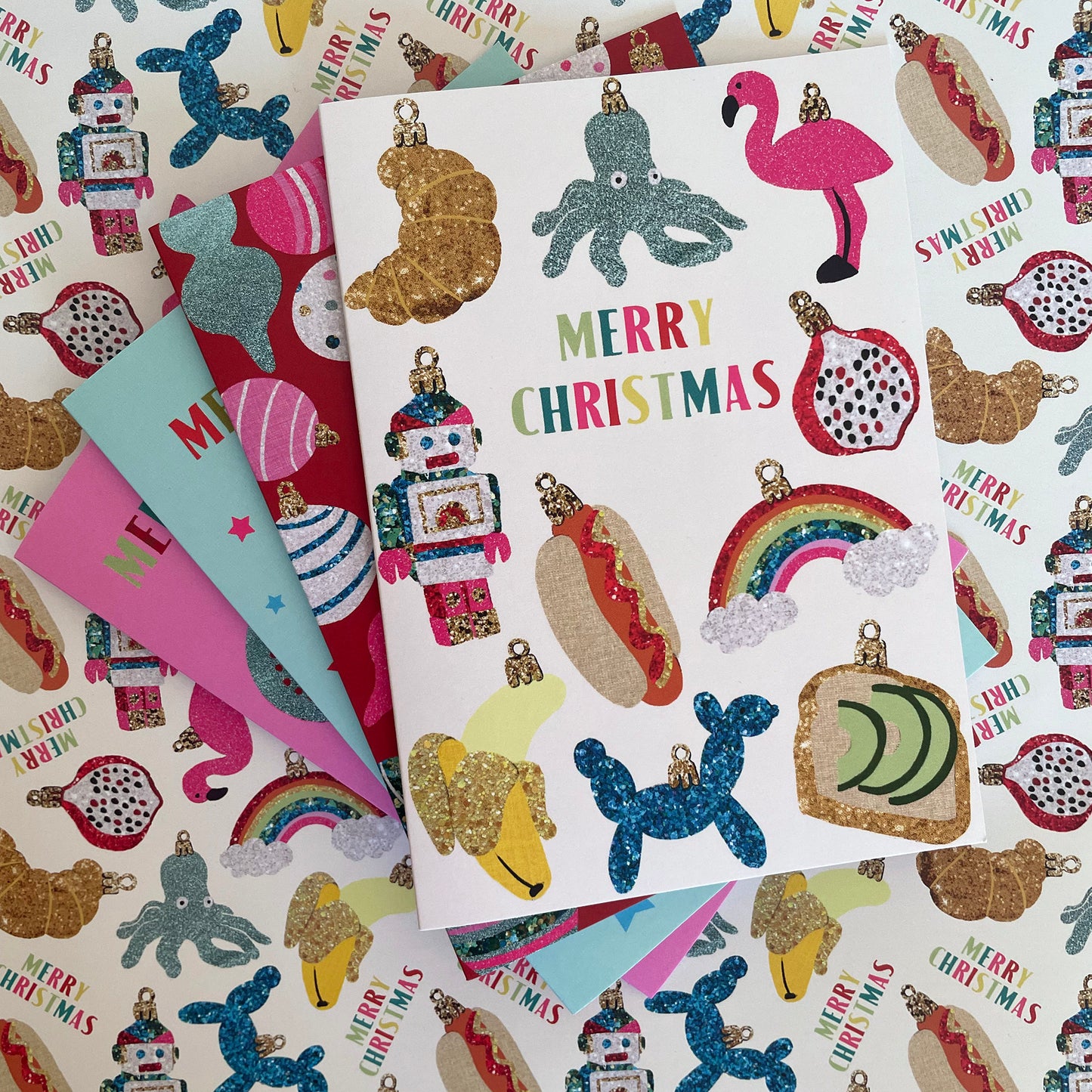 Image shows a collection of colourful Christmas cards with fun designs inspired by baubles.