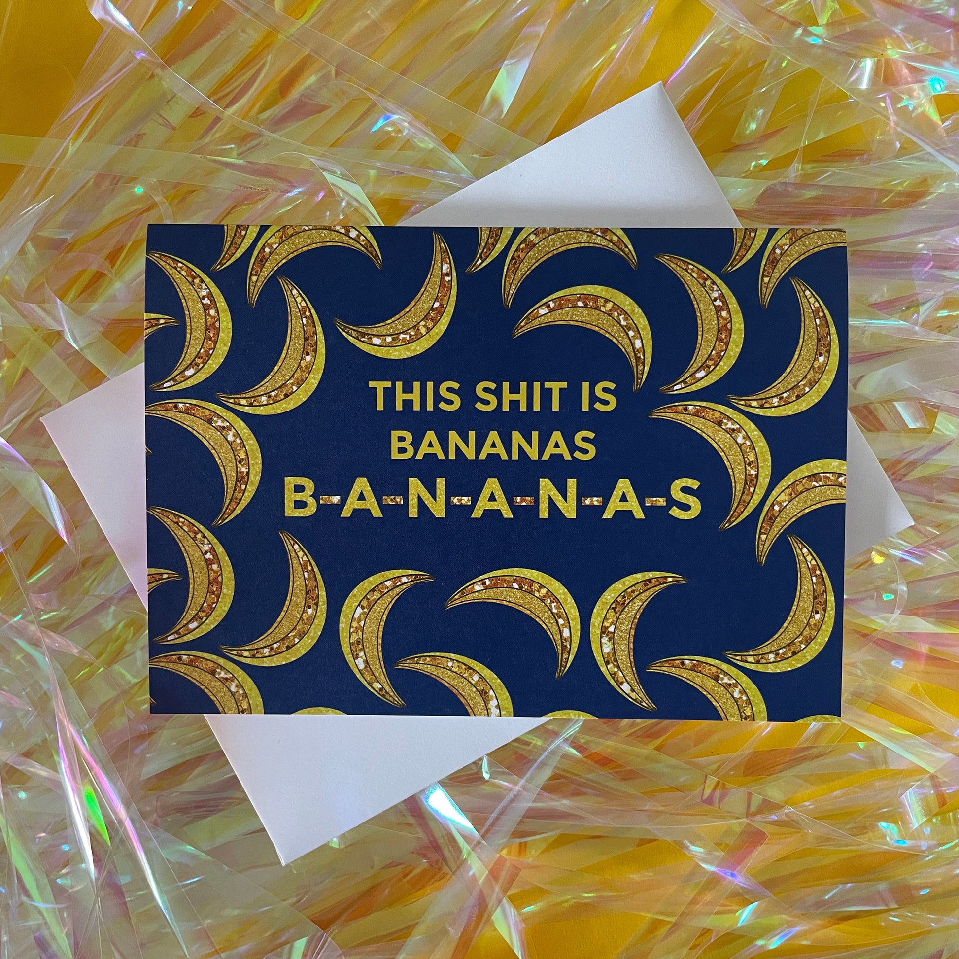 Image of a blue card featuring bejewelled illustrations of bananas and the message 'This Shit is Bananas B-A-N-A-N-A-S.