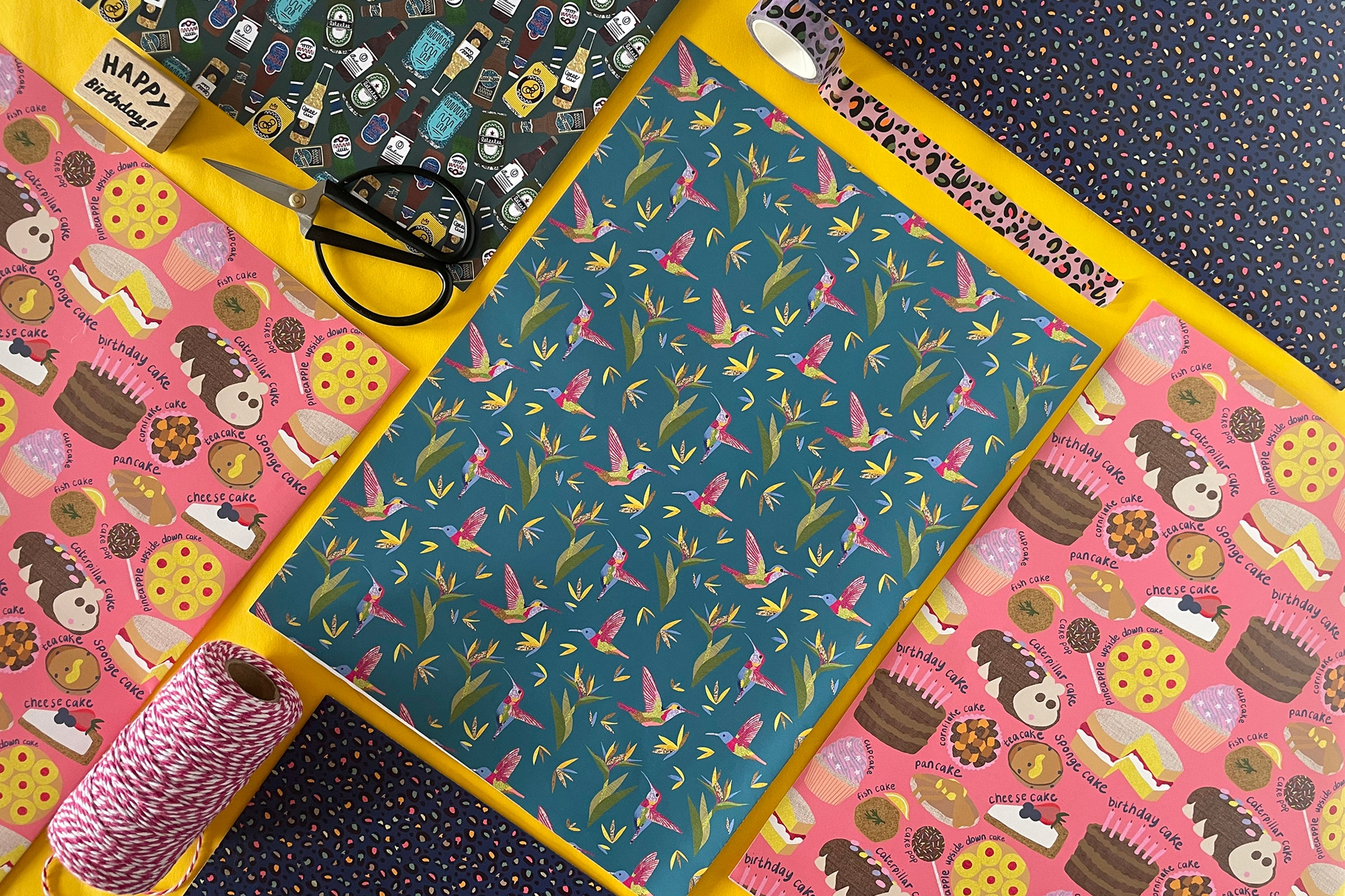 Image shows a bright and colourful collection of Katsillustration wrapping paper