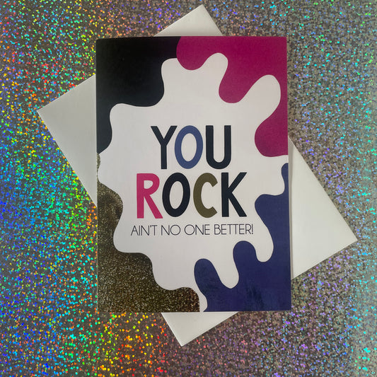 Image shows a bright greetings card with colourful, abstract shapes around the edge and the wording "You Rock ain't no one better"
