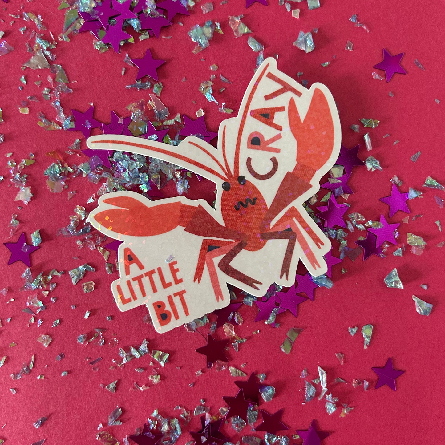 Sticker of a crayfish with text on a red background with star-shaped confetti.