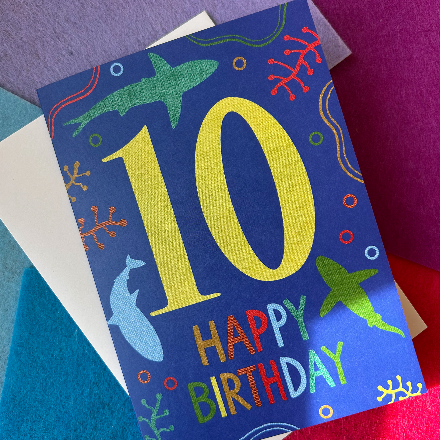 Colourful birthday card with number 10 and 'Happy Birthday' text.
