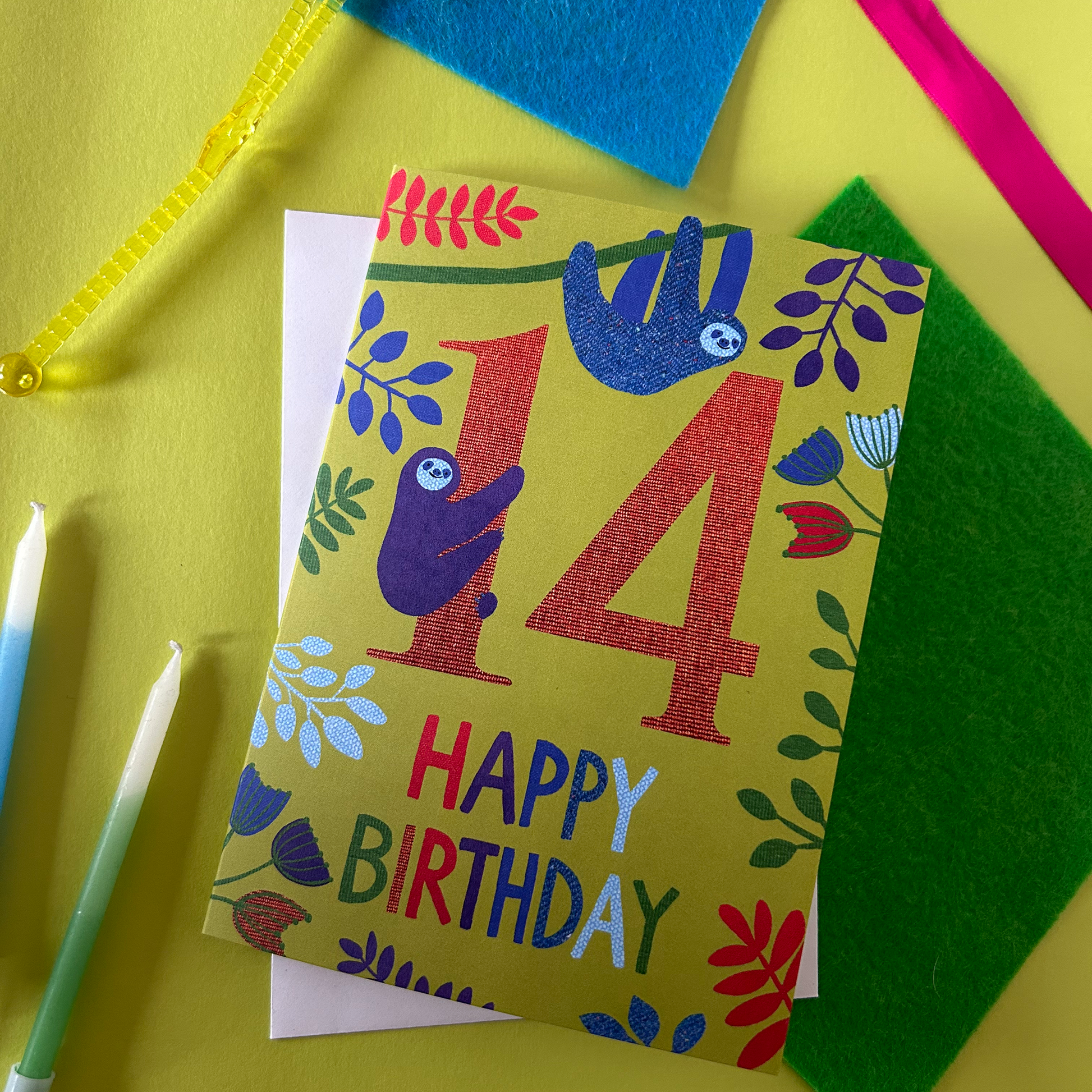 Colourful birthday card with number 14 and 'Happy Birthday' text on a yellow background.