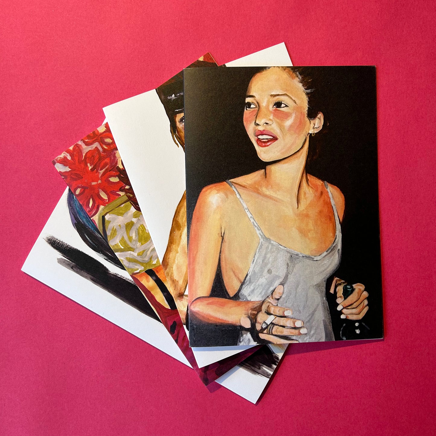 Set of greeting cards with artistic illustrations on a pink background