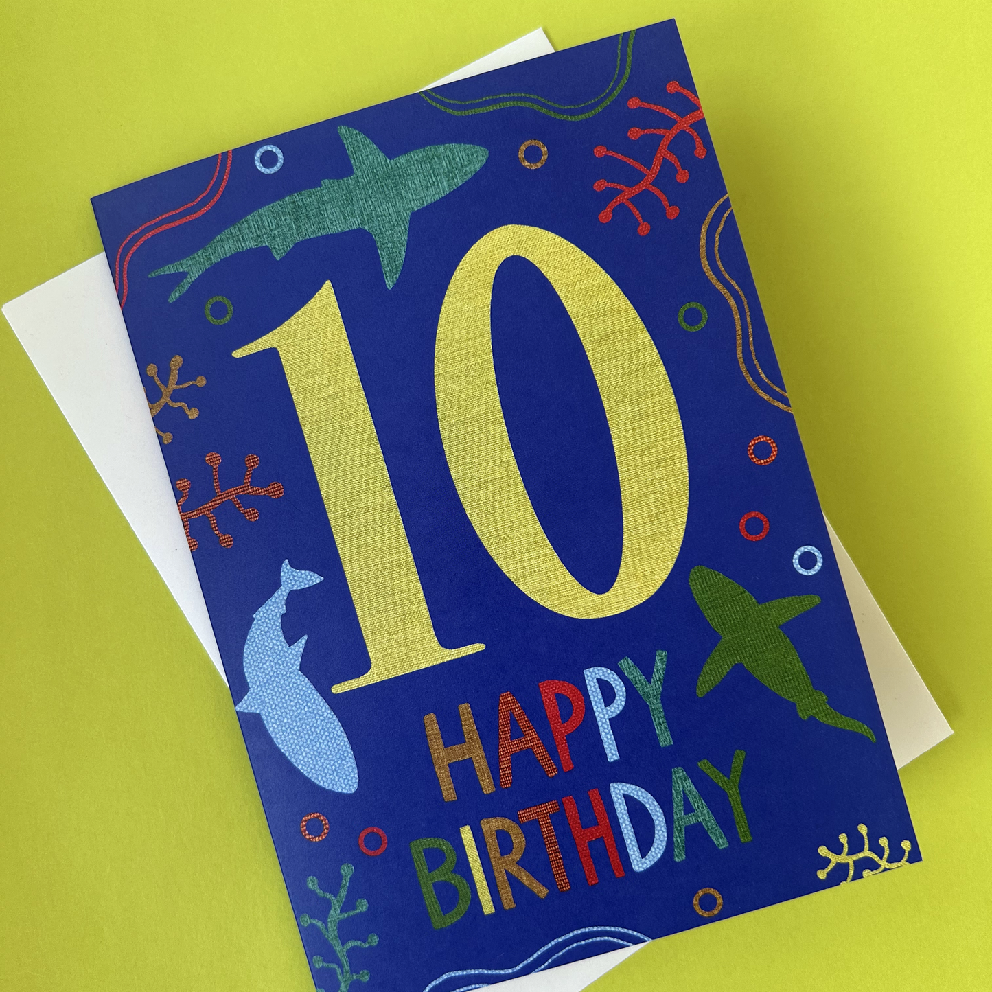 Birthday card with number 10 and 'Happy Birthday' on a blue background with sea-themed illustrations.