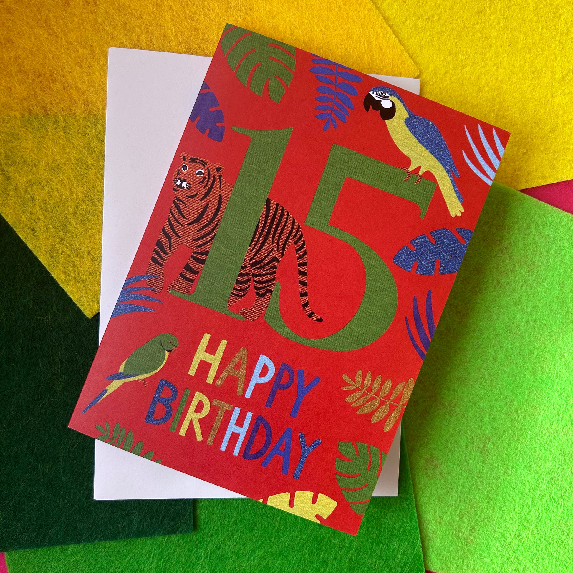 Birthday card with animals and 'Happy Birthday' text on a colourful background