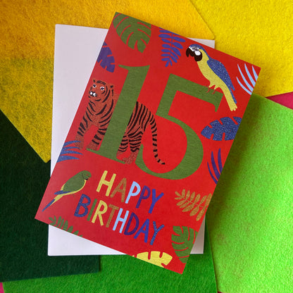 Birthday card with animals and 'Happy Birthday' text on a colourful background