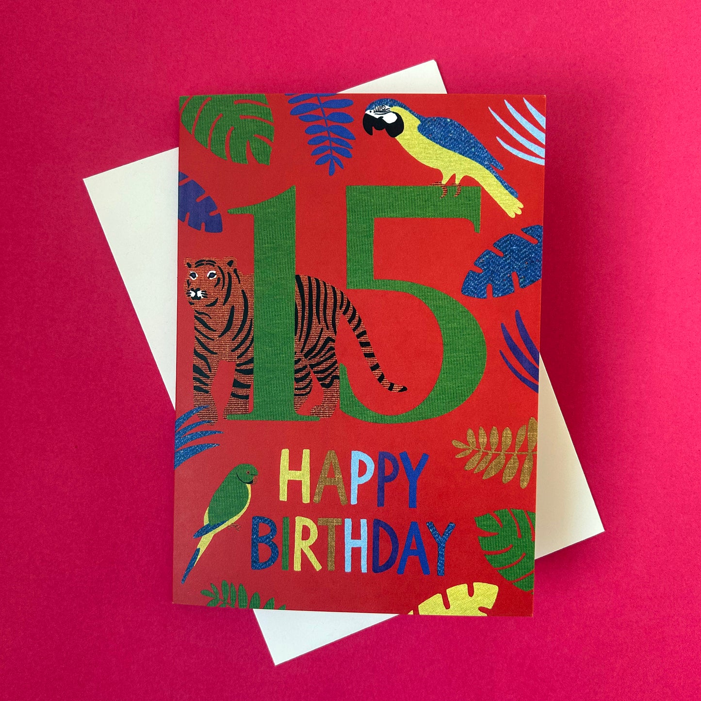 Birthday card with animals and 'Happy Birthday' text on a red background