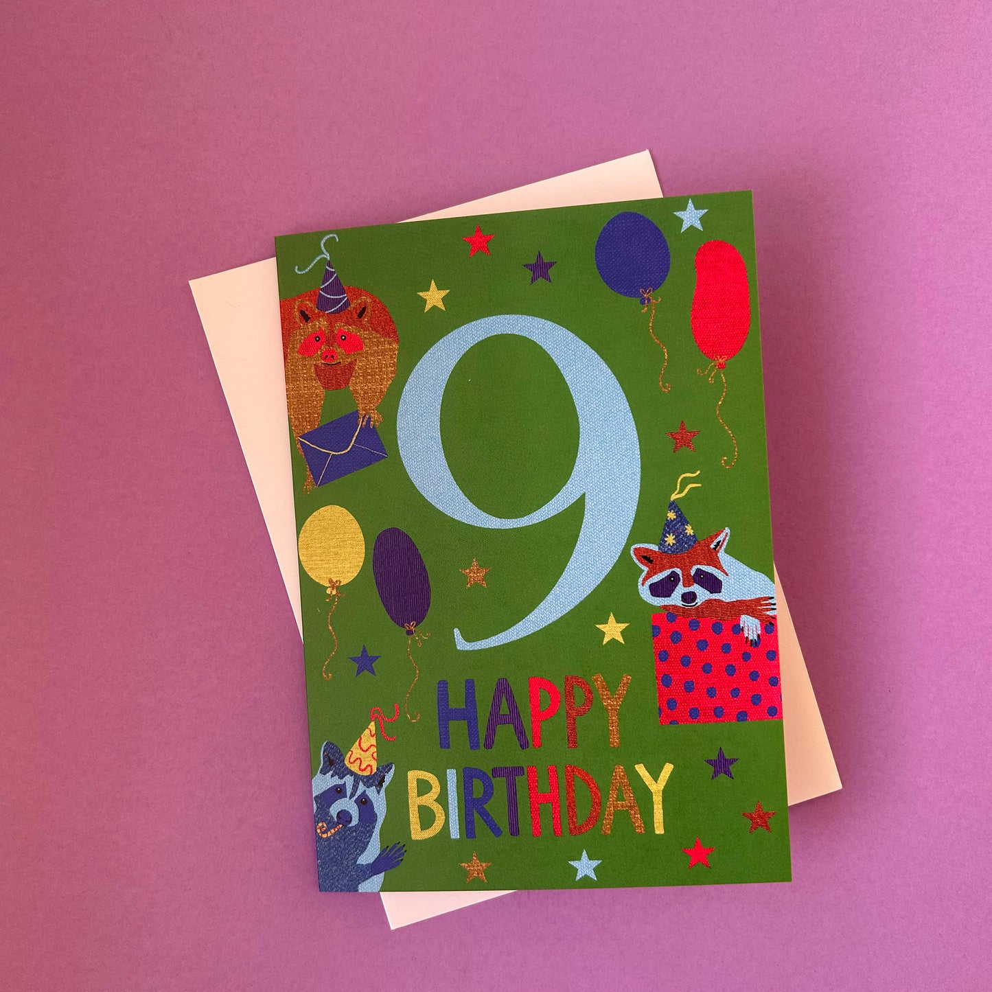 Birthday card with number 9 and birthday elements on a purple background