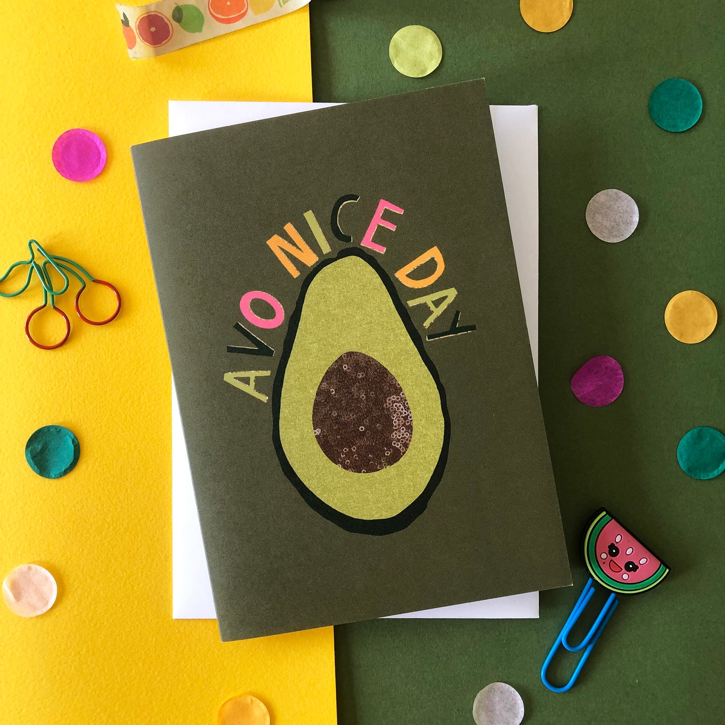 Image shows a green "everyday" greetings card that says 'avo nice day' and features an illustration of an avocado