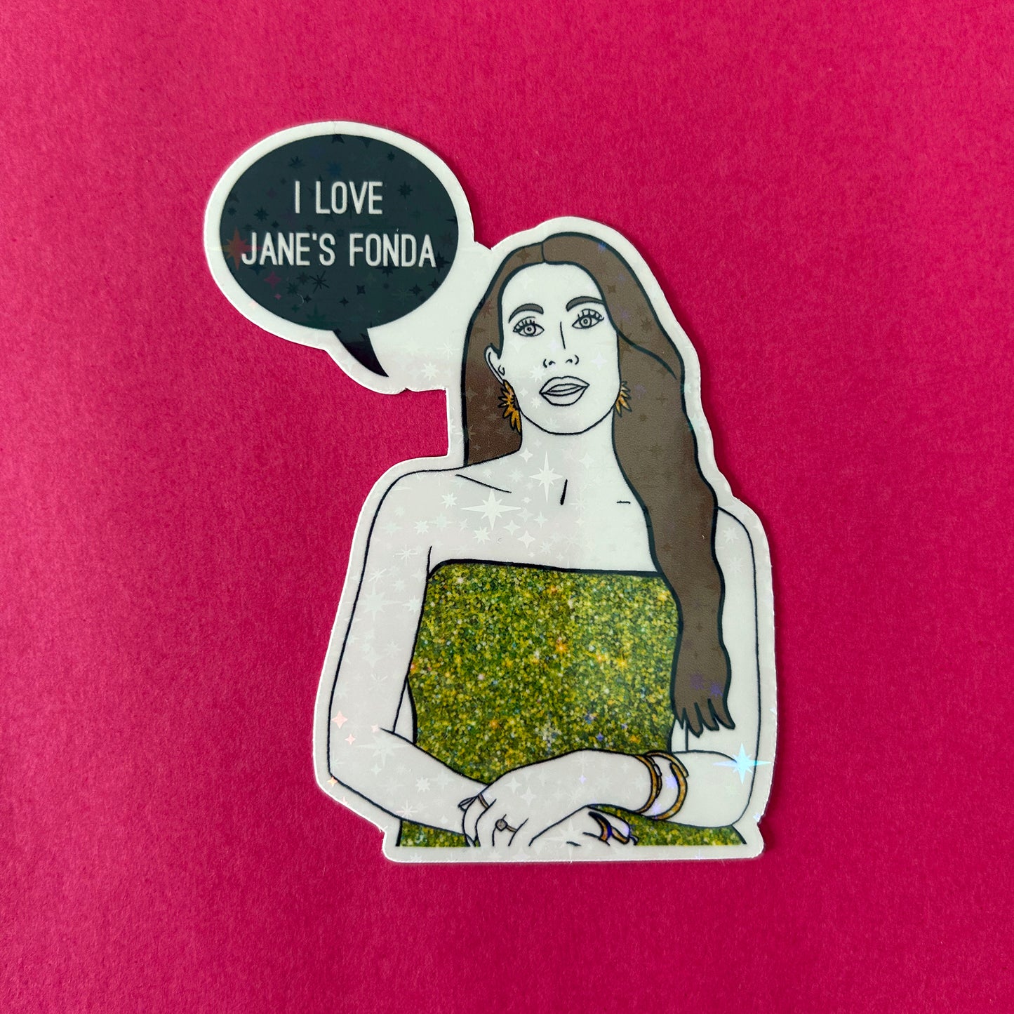 Sticker of a woman with a speech bubble saying 'I LOVE JANE'S FONDA' on a pink background