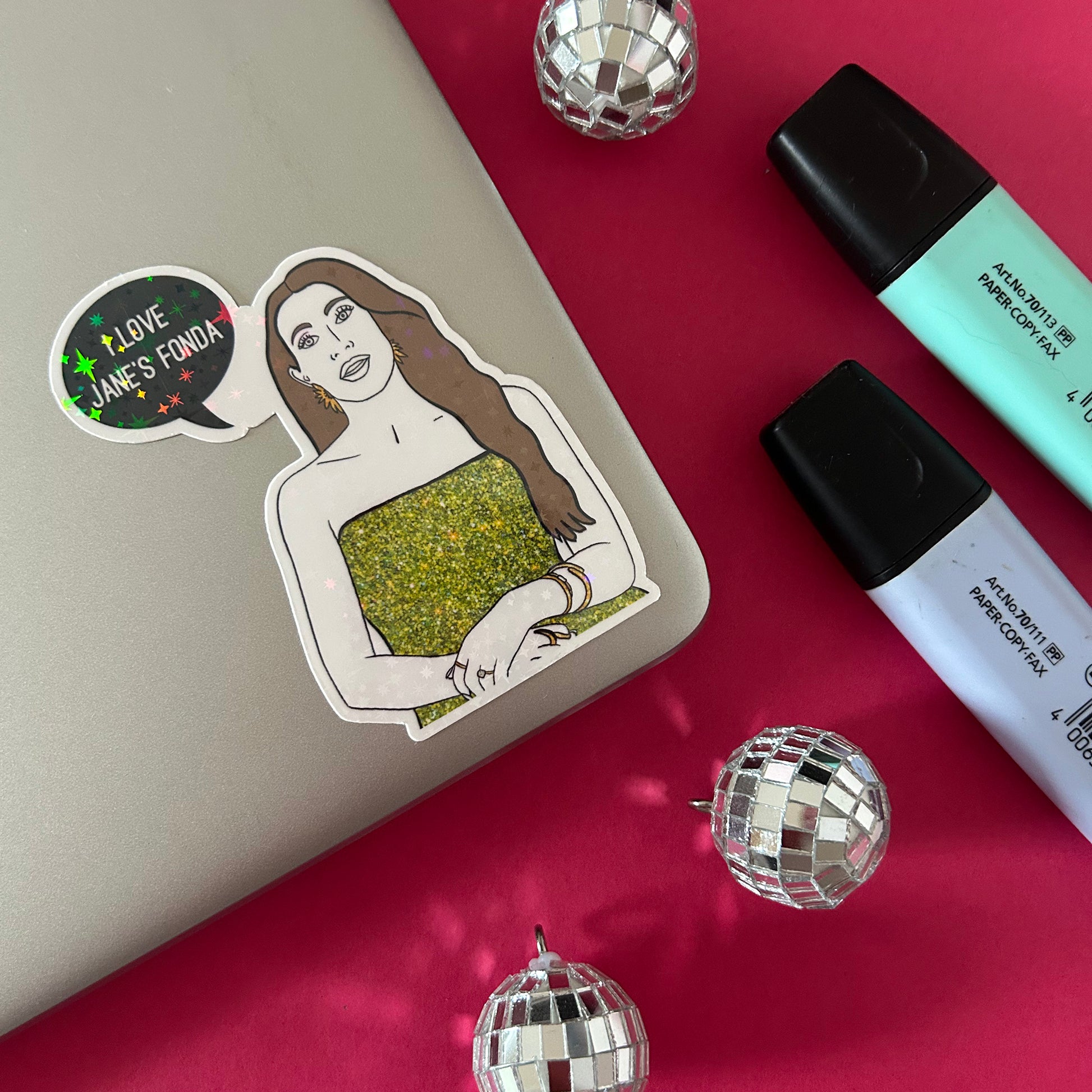 Sticker of Alicia from RHORI on a laptop with disco balls and markers.