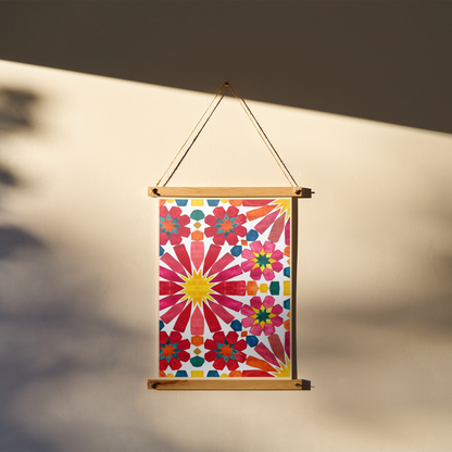 Colourful floral patterned poster hanging against a neutral background