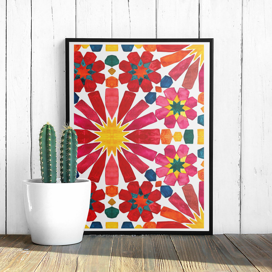 Colourful abstract floral patterned poster on a white wall with a cactus plant.