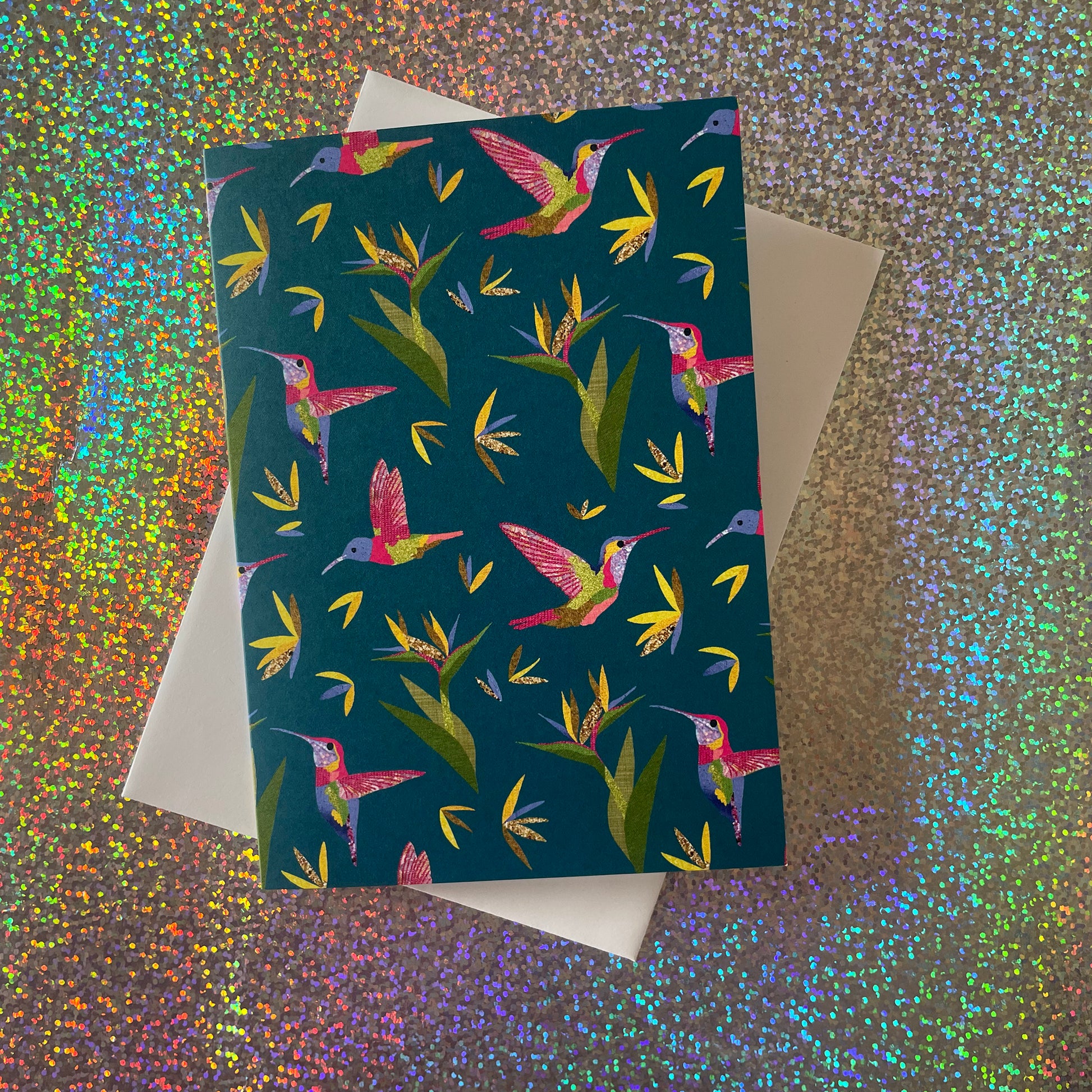 Image shows a single card and envelope from a beautiful set of 4 notecards with a hummingbird and bird of paradise plant pattern