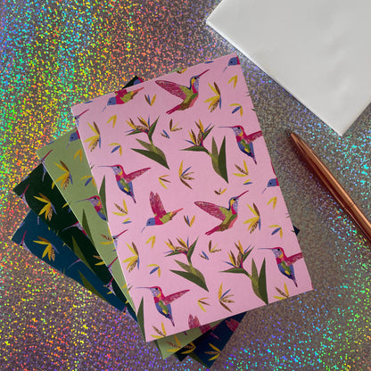 Image shows a beautiful set of 4 notecards with a hummingbird and bird of paradise plant pattern