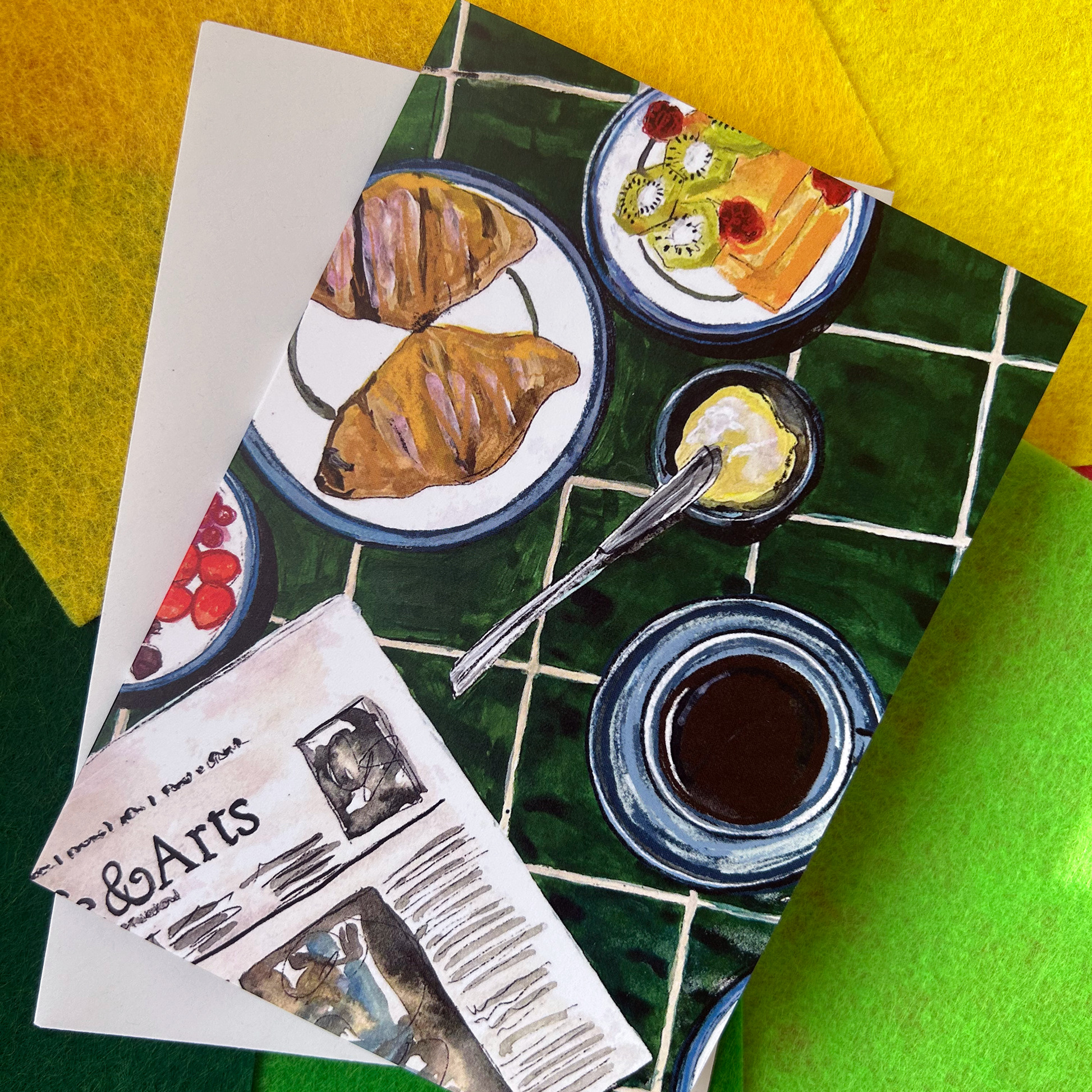 Art card with a breakfast table illustration on a colourful background