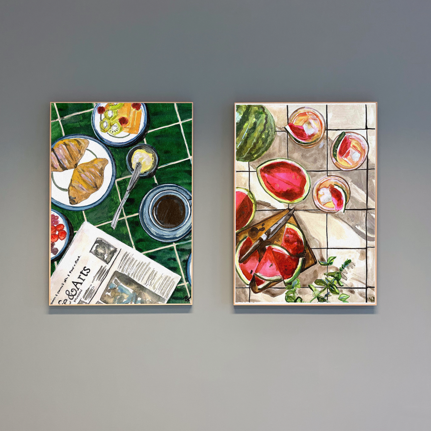 Two wall art prints depicting food scenes on a gray background