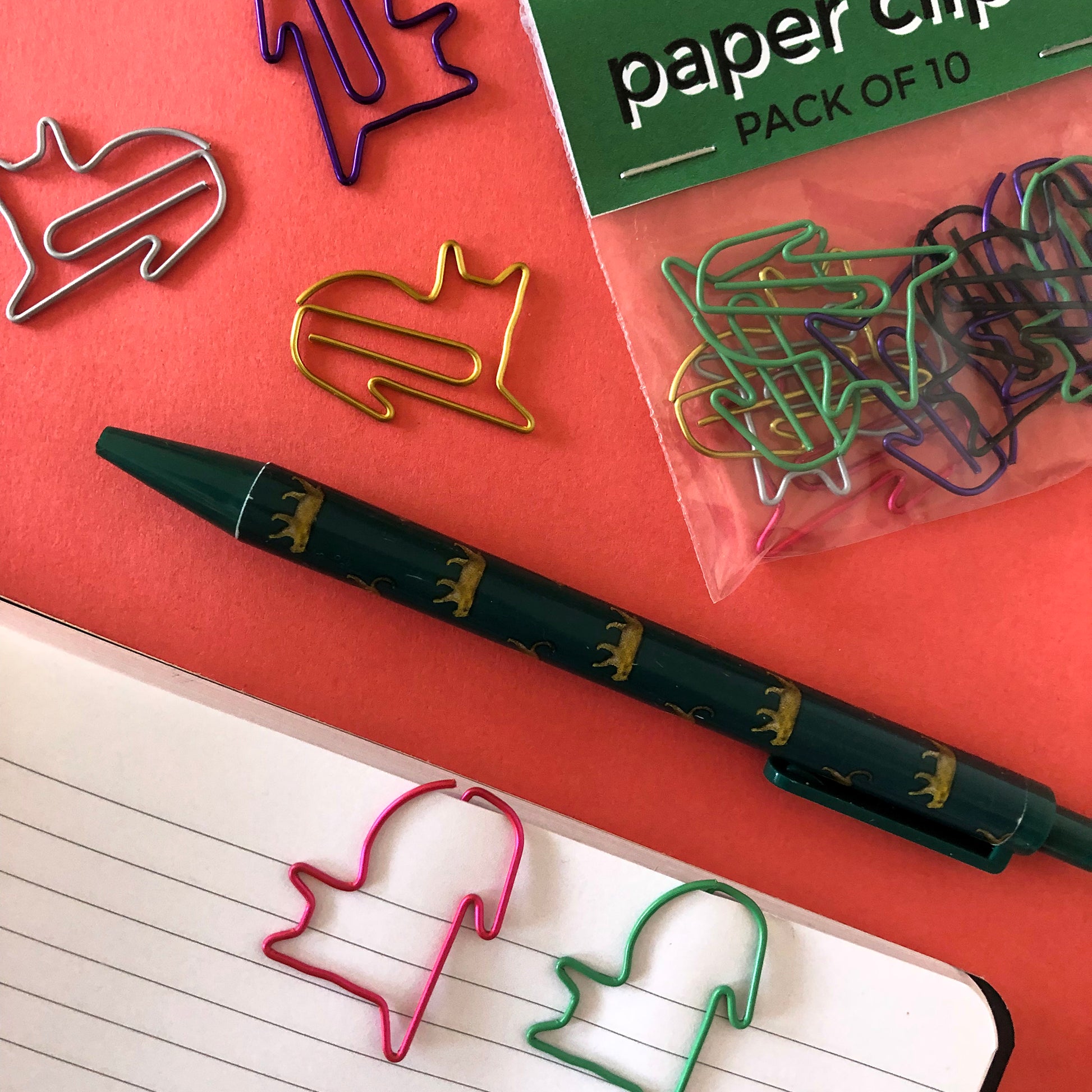 Image shows a set of cute and colourful, cat shaped paperclips.