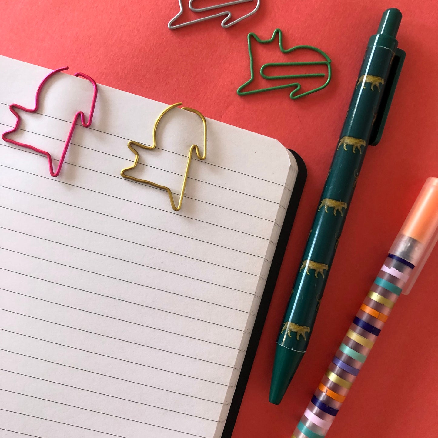 Image shows a set of cute and colourful, cat shaped paperclips.