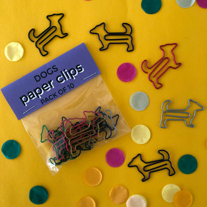 Image shows a set of cute and colourful, dog shaped paperclips.