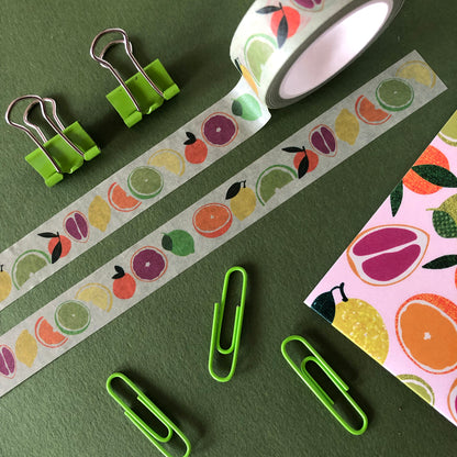 Image shows a pale green washi tape with a colourful citrus fruit print