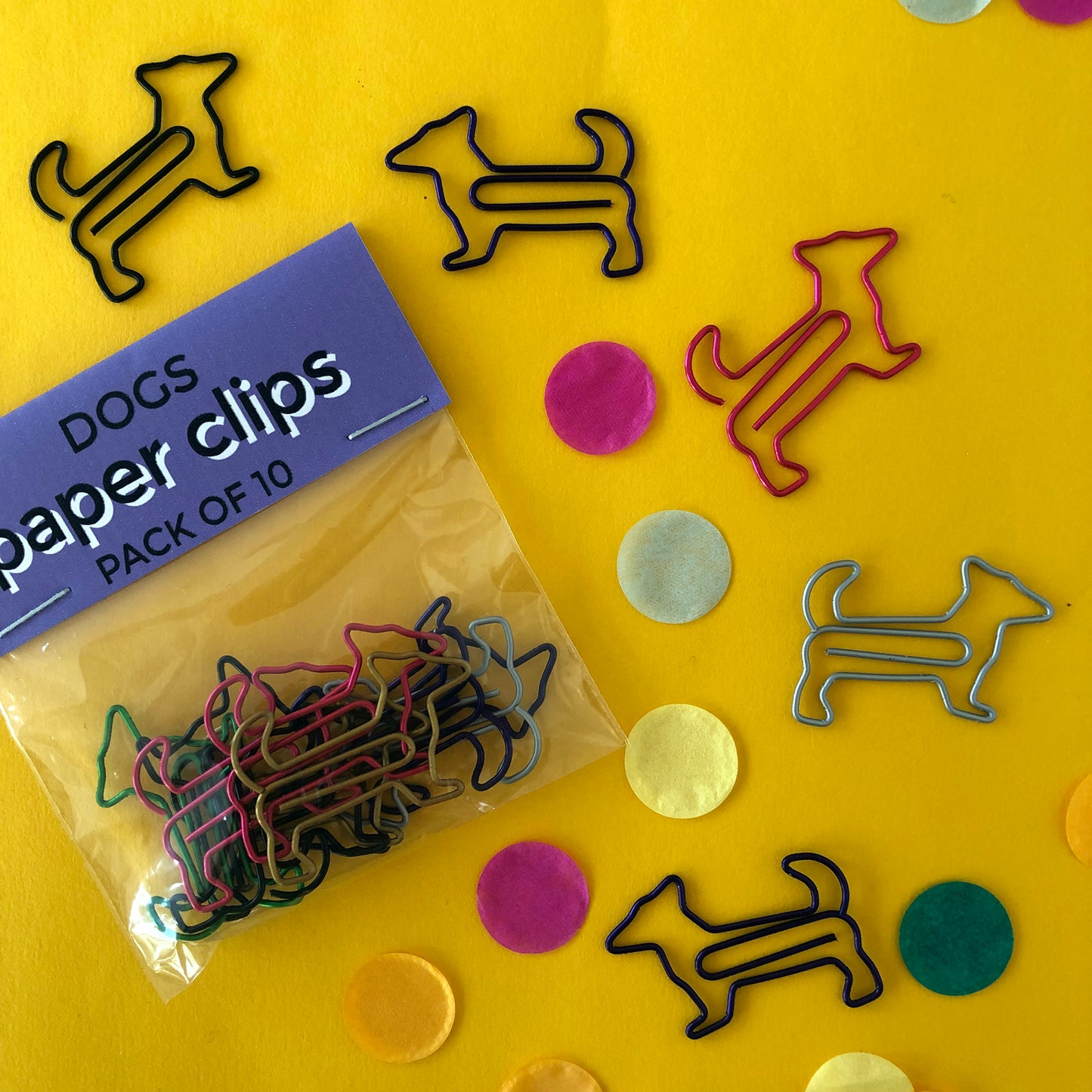 Image shows a set of cute and colourful, dog shaped paperclips.