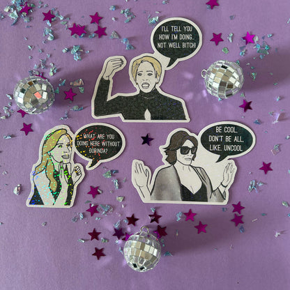 Stickers of Dorinda, Luann and Sonja from RHONY on a purple background with disco balls and stars.