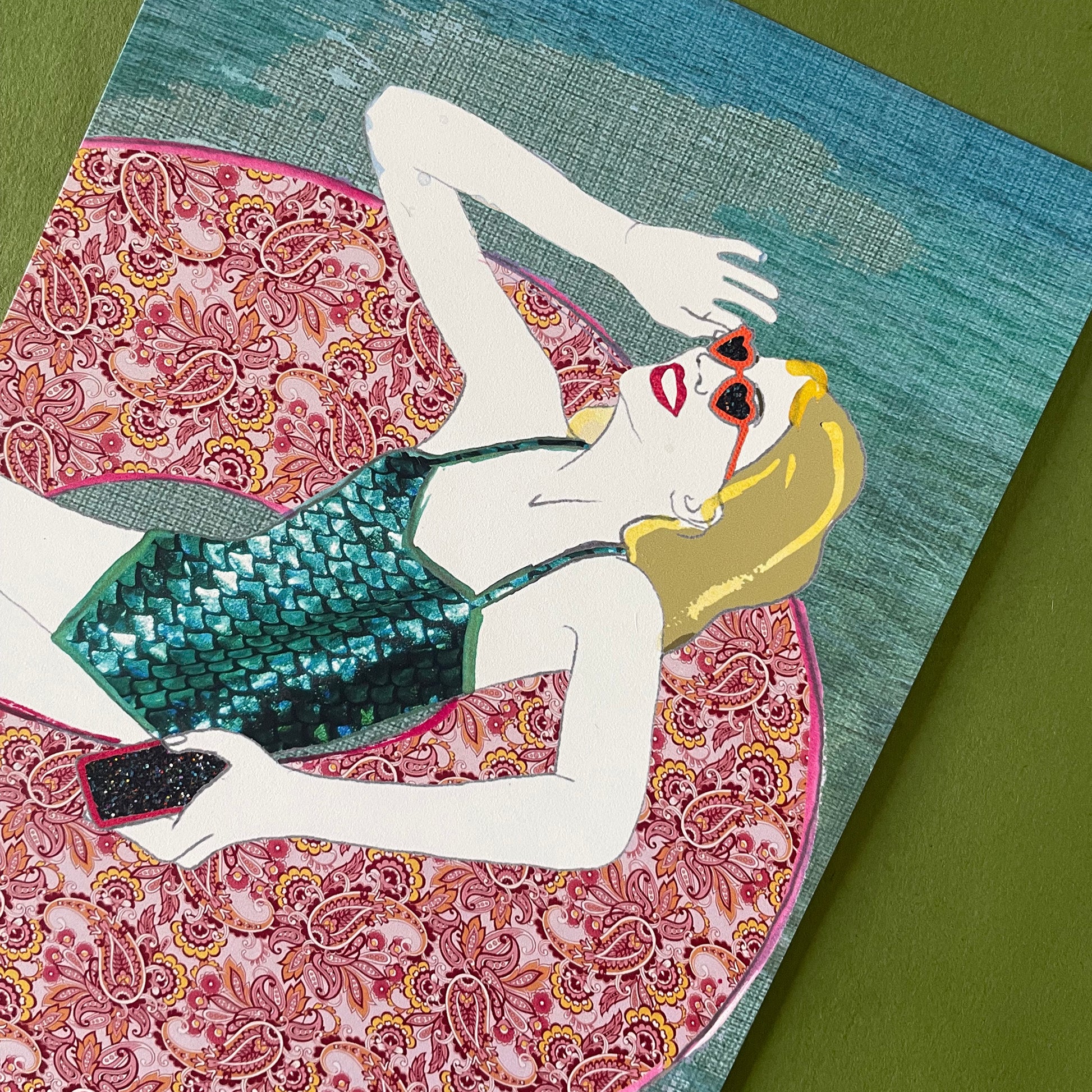 Close up image showing the detail and texture of an art print featuring a woman relaxing in a pool ring in the summer