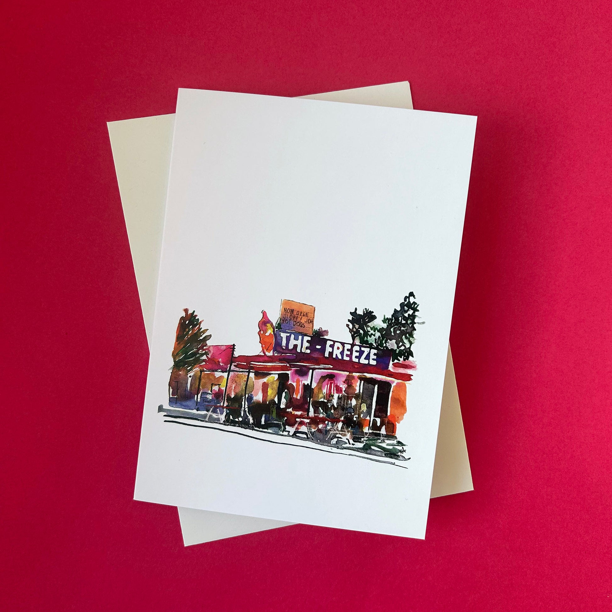 Greeting card with 'The Freeze' restaurant illustration on a red background