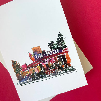 Illustration of a store front with 'The Freeze' sign on a white card against a red background