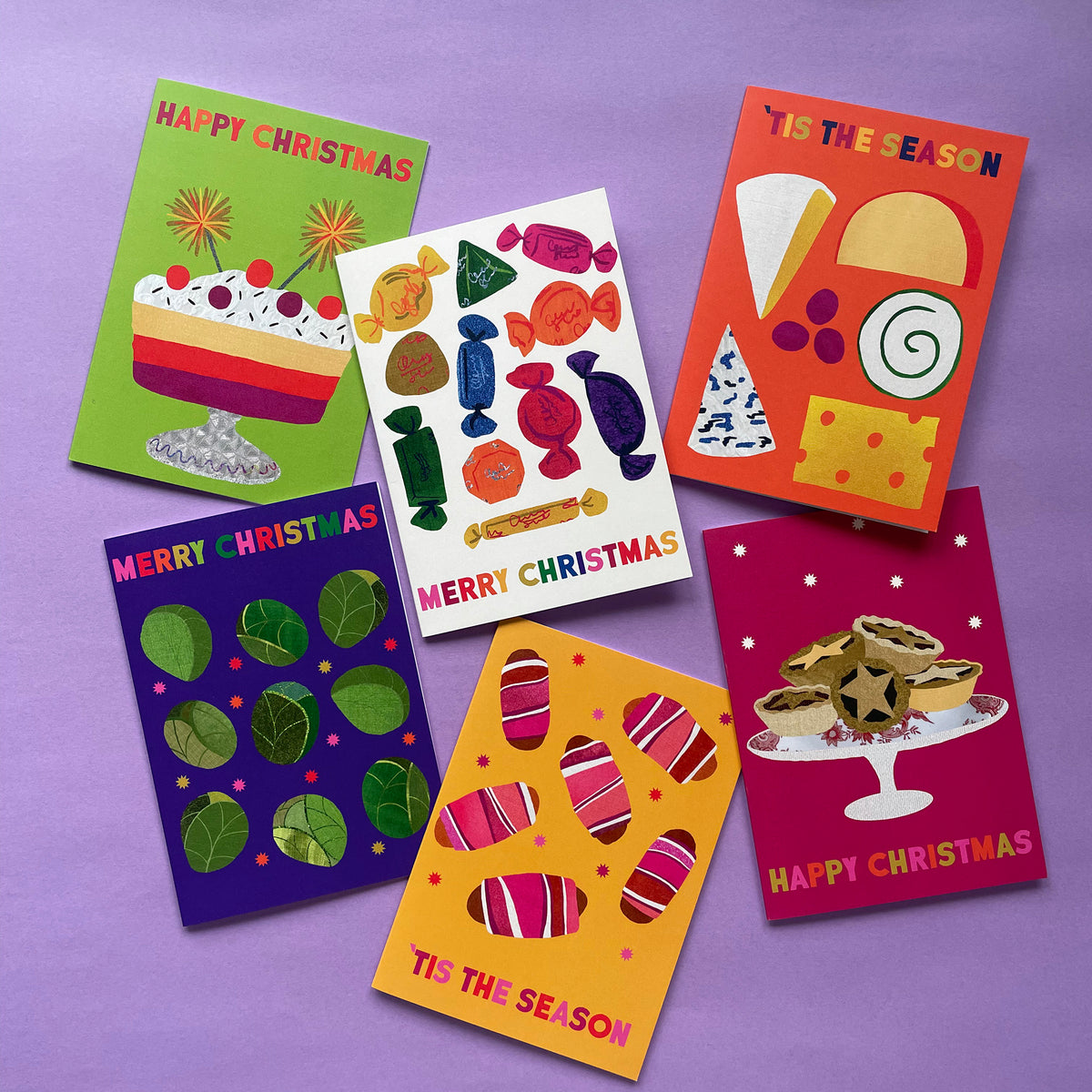 Set of colourful Christmas cards on a purple background