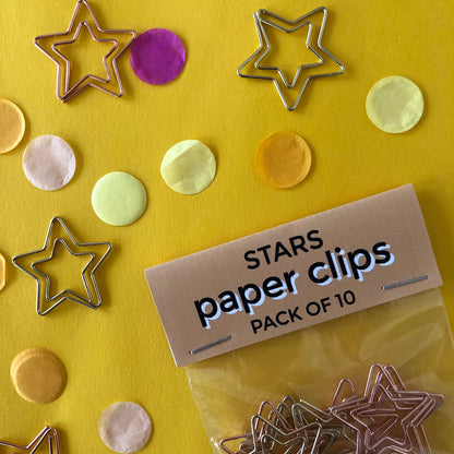 Image shows a set of gold and rose gold, star shaped paperclips.