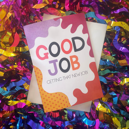 Image shows a bright greetings card with colourful, abstract shapes around the edge and the wording "Good Job getting that new job!"