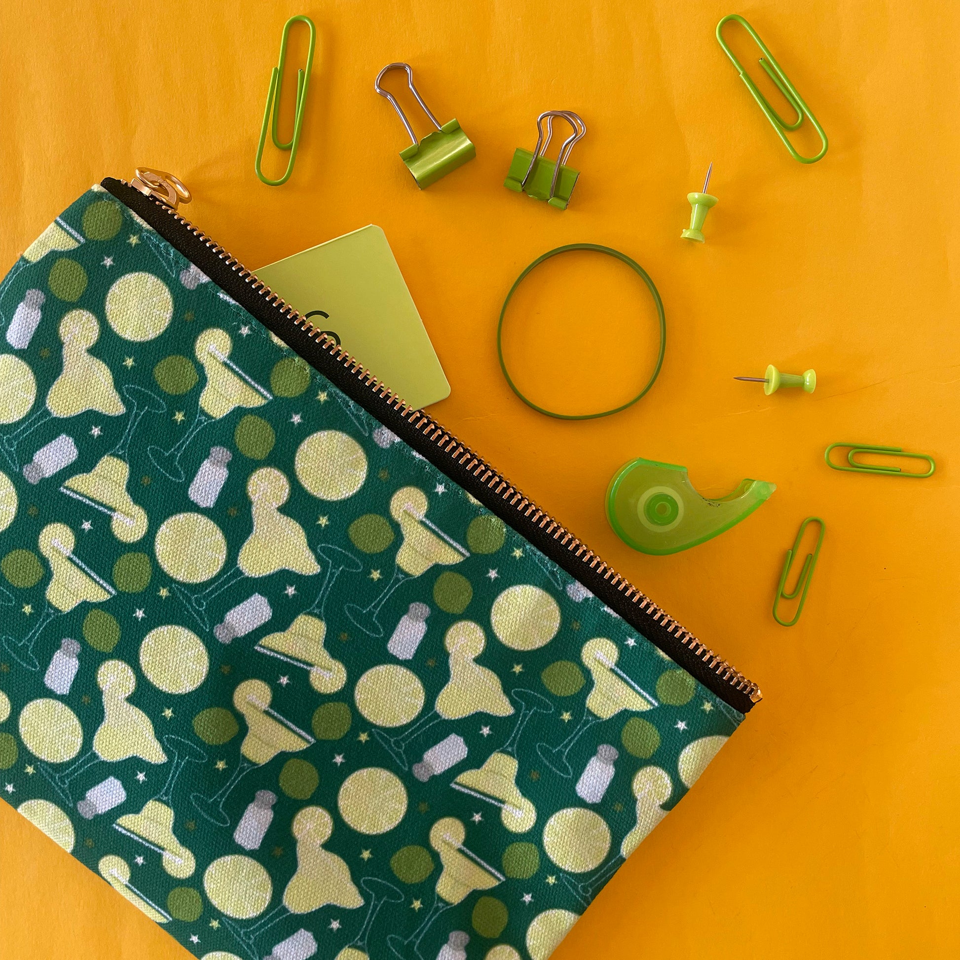 Image shows a green zip pouch with a fun margaritas cocktail design.