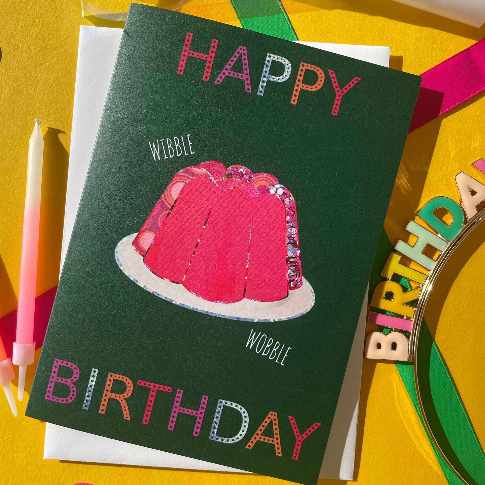 Image shows a green birthday card with a pink collaged jelly and 'Happy Birthday' in colourful lettering.