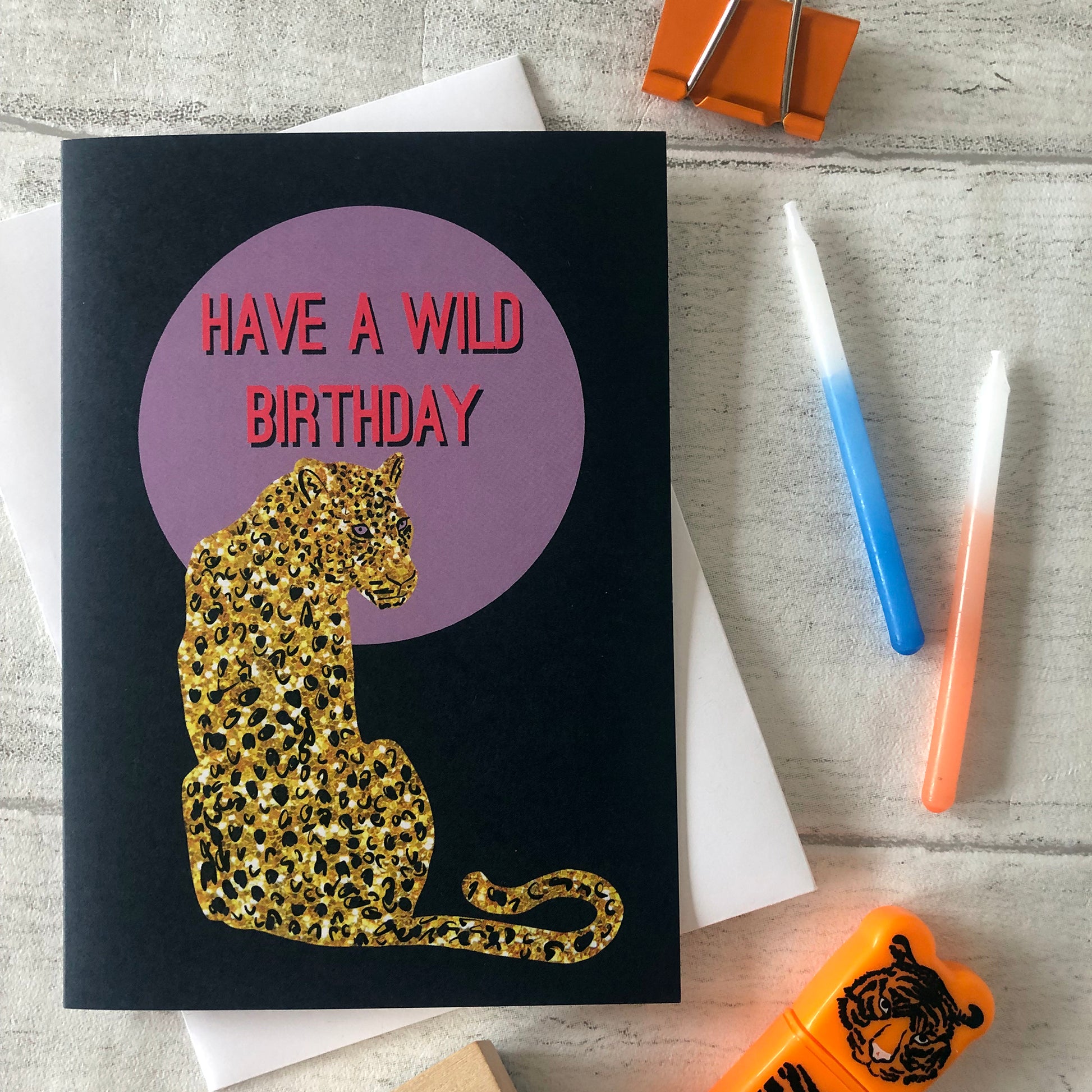 Wild birthday card featuring a gold glitter leopard in front of a lilac full moon.