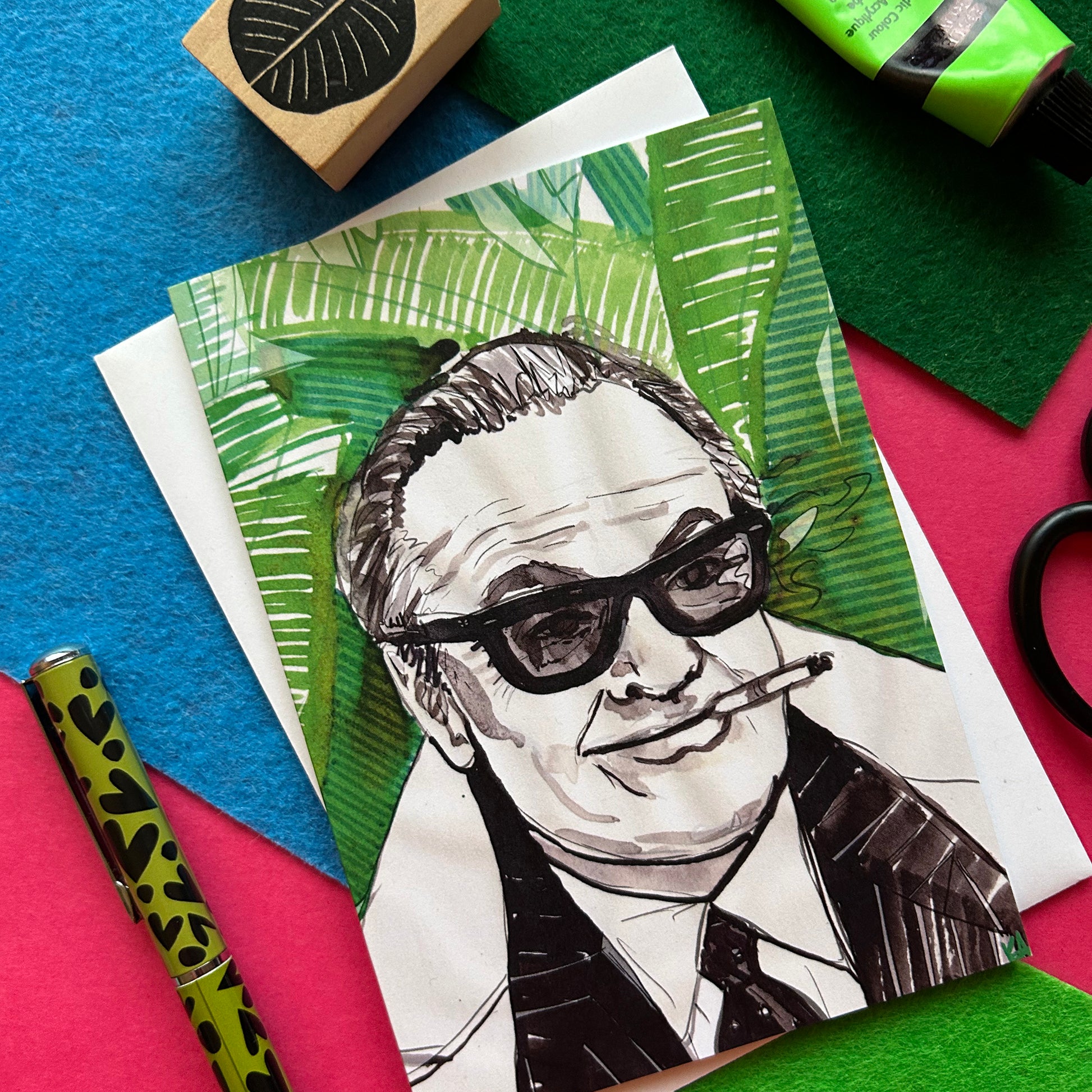 Illustration of a person with sunglasses and a cigarette on a colorful background with art supplies.