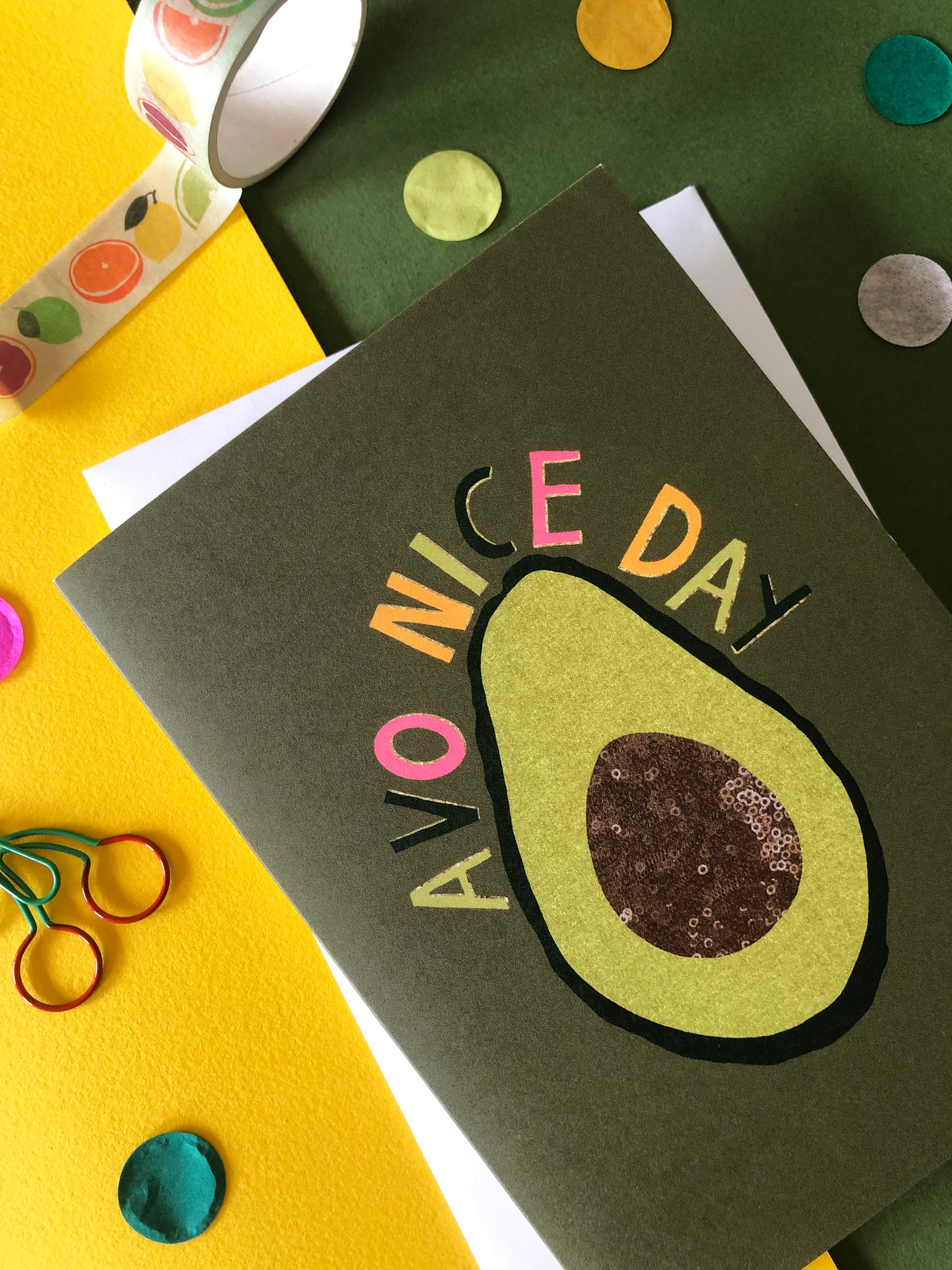 Green "everyday" greetings card that says 'avo nice day' and features an illustration of an avocado
