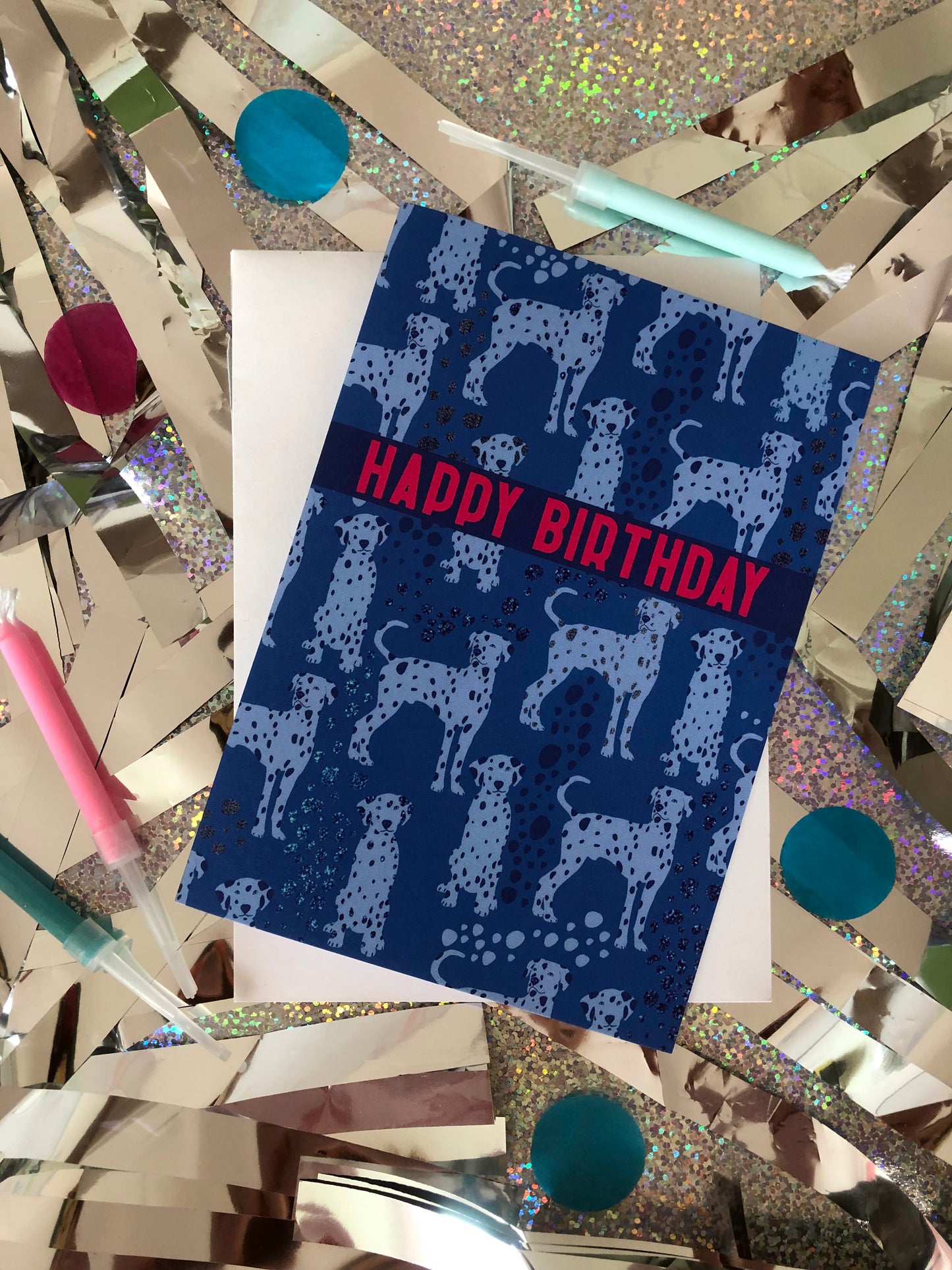 Blue Dalmatian print birthday card featuring a cute dog design on a holographic and silver background.